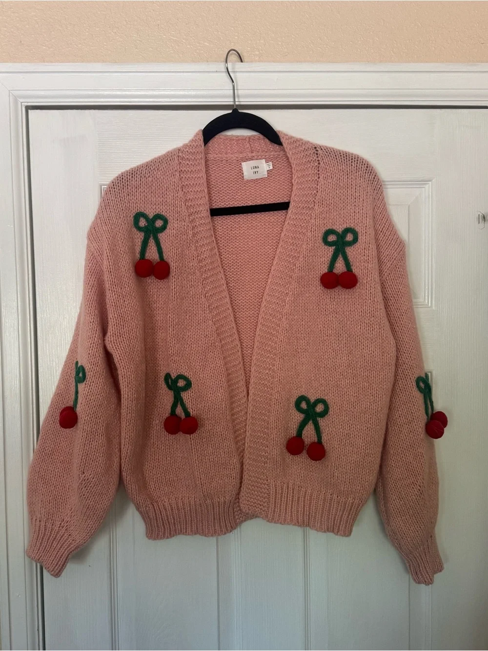 Pink Luna Ivy cardigan featuring prominent green and red 3D cherry appliqués. - Picture 2 of 6